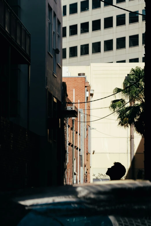 the side of buildings in front of an electric wire