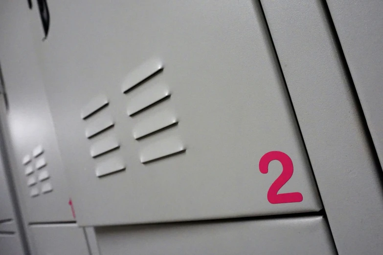 a pink number on an electronic equipment unit