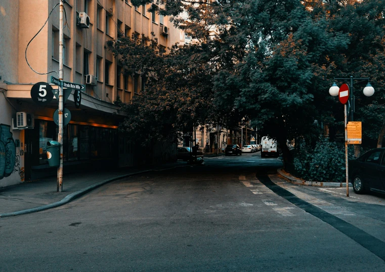 a car is parked on the corner of the street