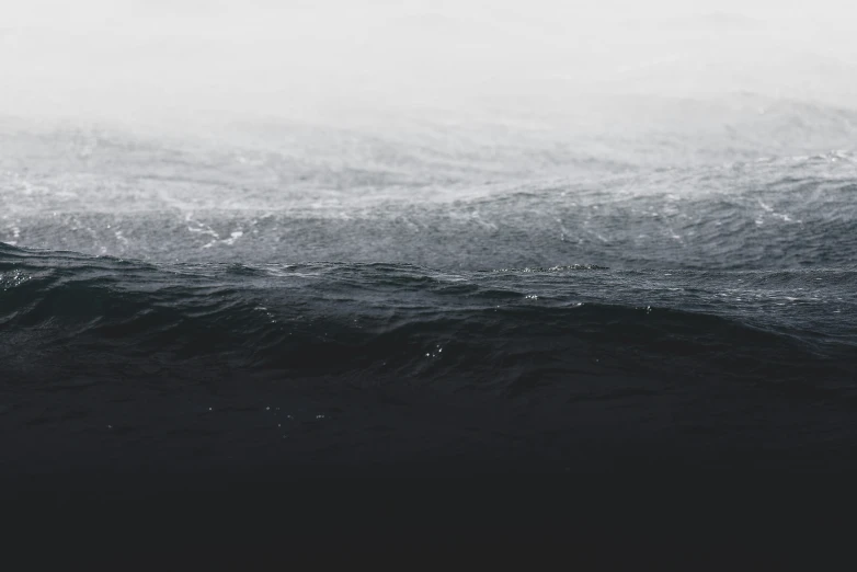 two surfers are riding a wave in the ocean