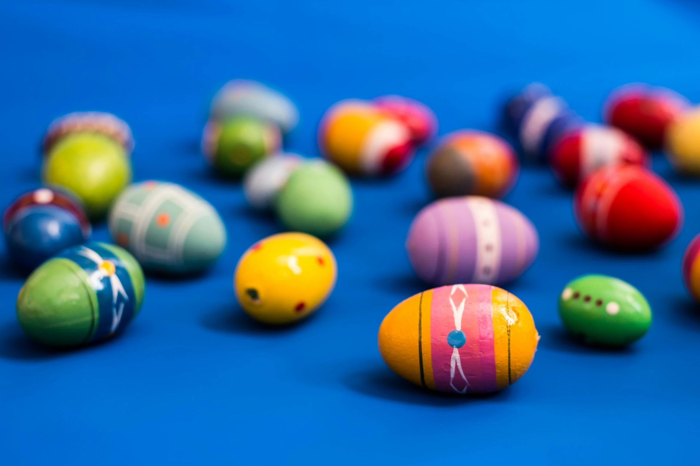 there are many colorful balls placed in the middle of the floor