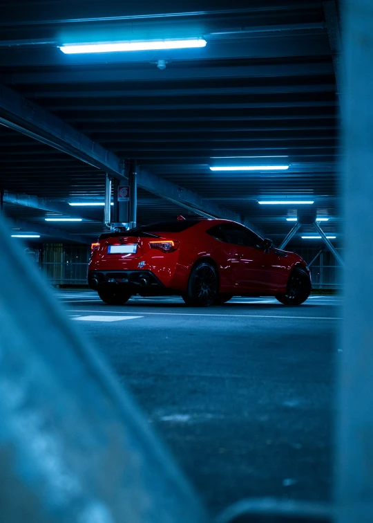 a car parked in a parking lot with an underpass