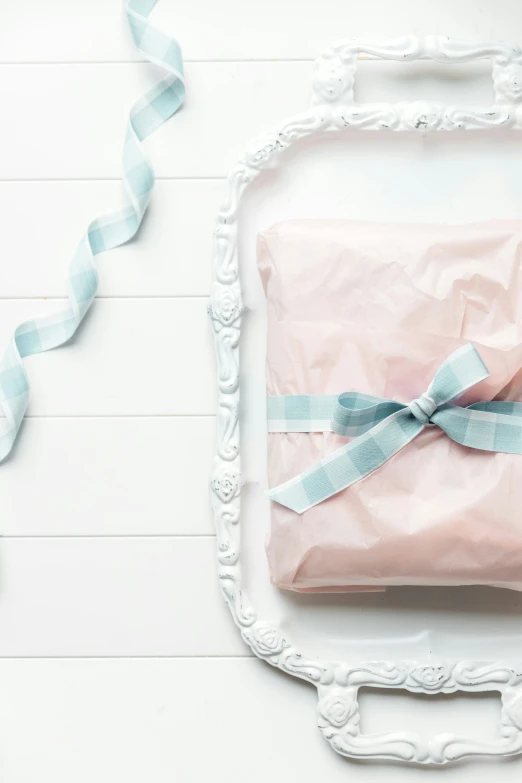 pink and blue baby shower gift wrap in a frame