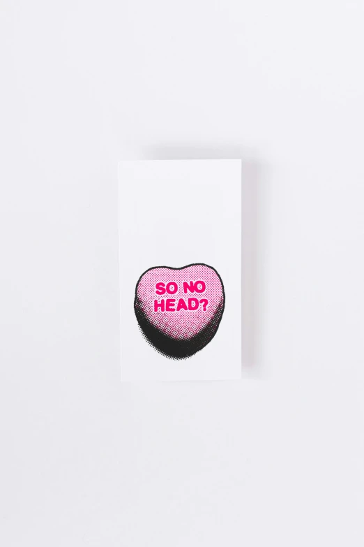 a square piece of paper with a pink heart and the text so no head on it