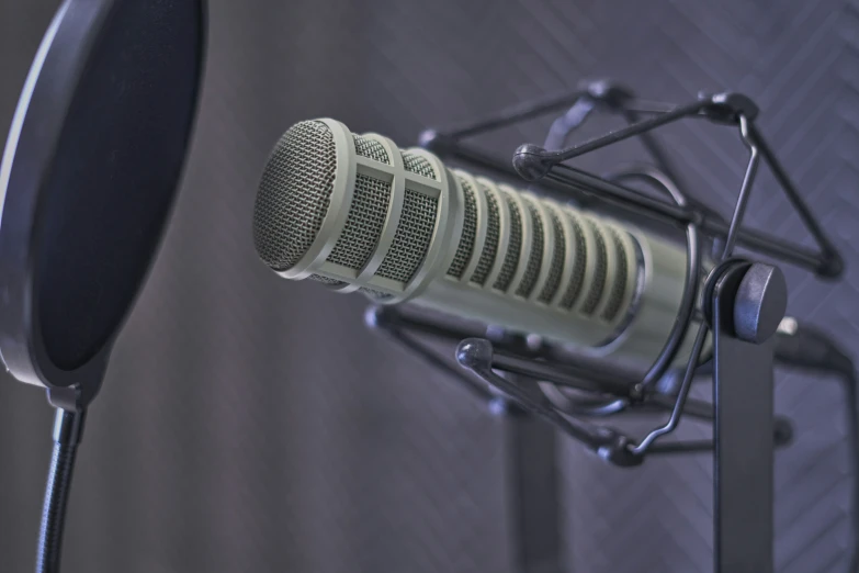 a microphone is in a recording studio, set up to provide a voice