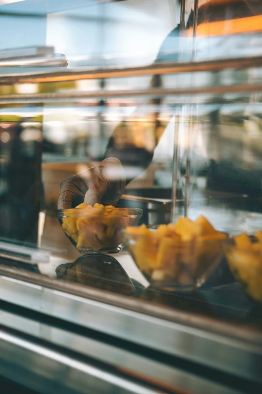 food in a metal bowl on the bottom of a counter