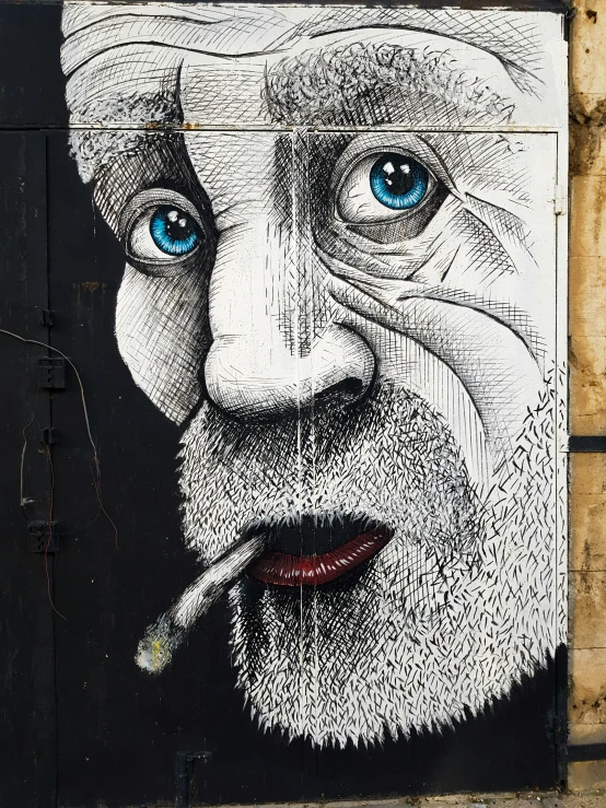 a mural depicting a bearded man smoking a cigarette