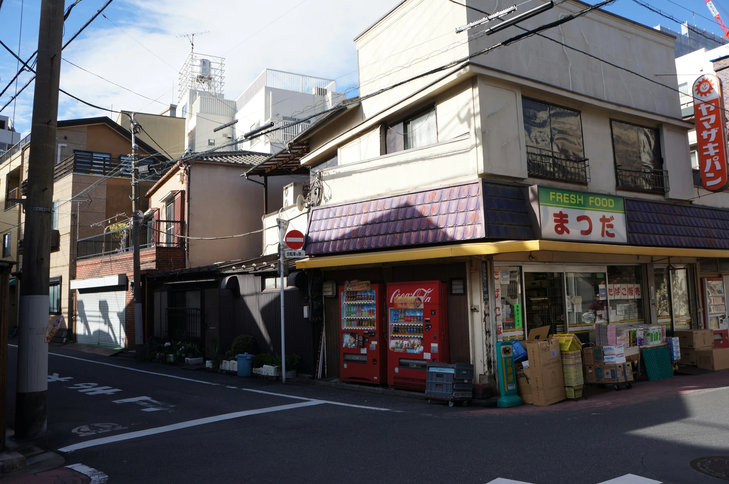 the corner shop with all the signs is empty