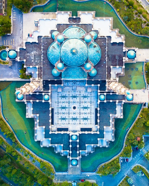 a aerial view of an architectural design in the middle of some grass