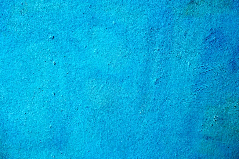 a blue stucco background with space for text