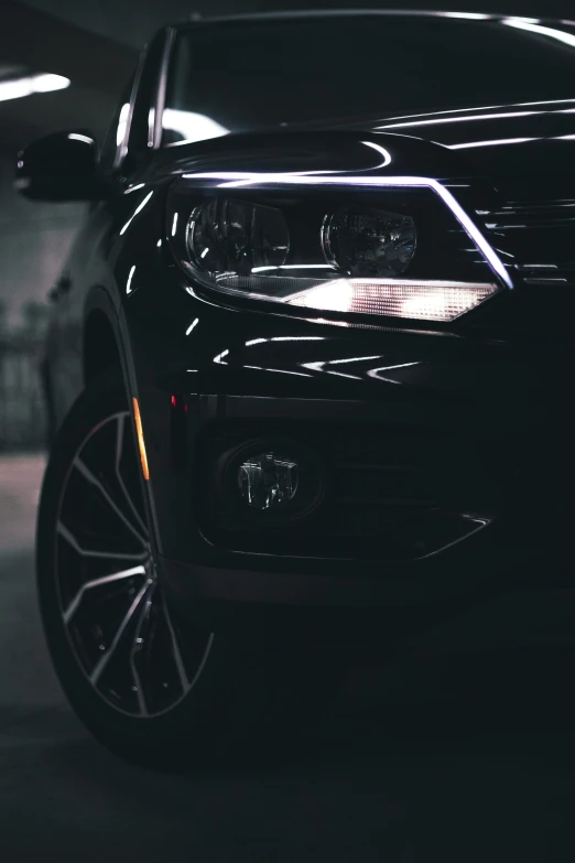 the front end of a black volkswagen car