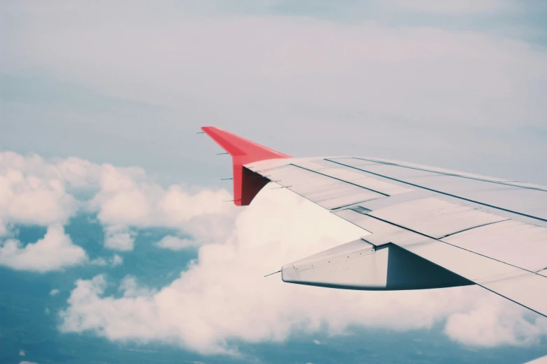 the view out of an airplane's window on top of clouds