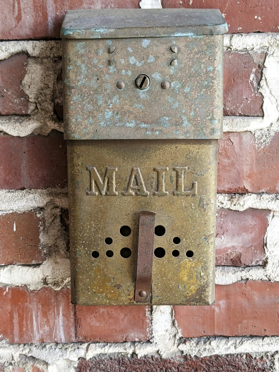 a metal sign attached to a brick wall