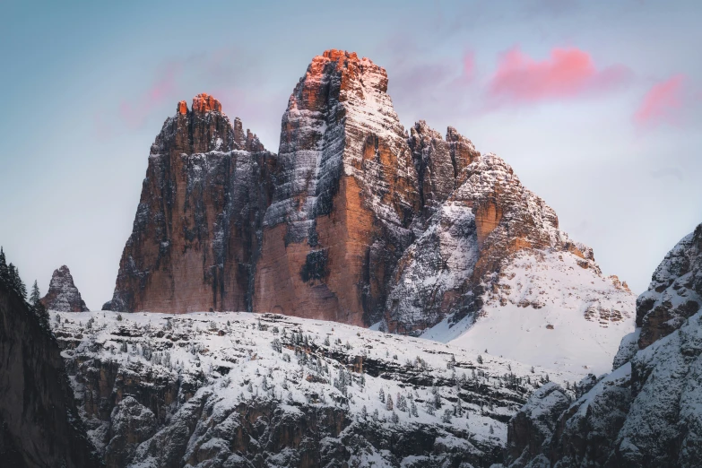 snowy mountain with mountains in the back ground