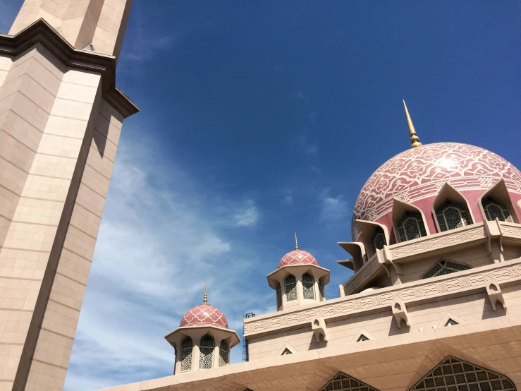 a tall building with two towers on top