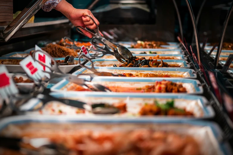 some very long lines of food in some containers