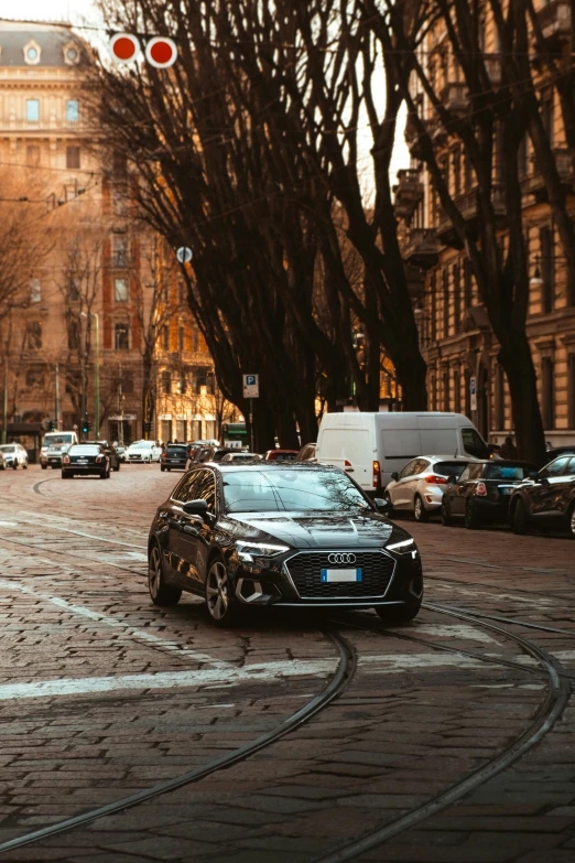 a black car and some buildings on a street