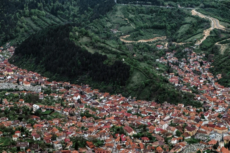 a small town is nestled between the mountains