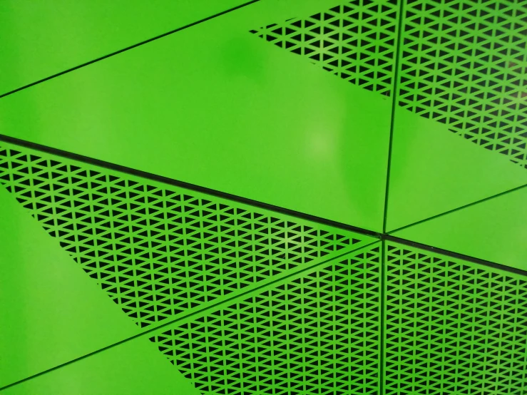 a close up of the perforated surface of a roof