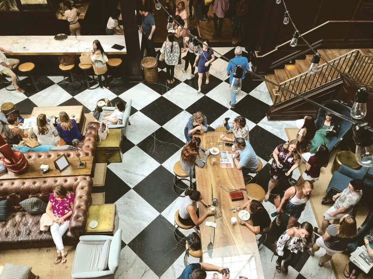 overhead s of people eating and drinking at an open - air restaurant