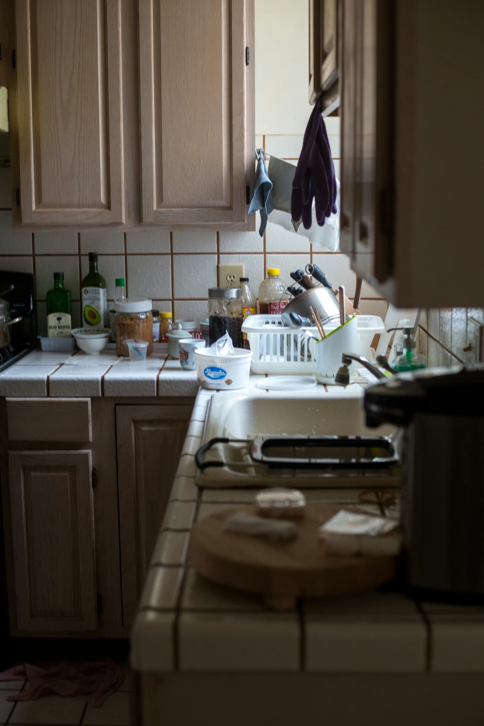 a kitchen with many cabinets and utensils and stuff