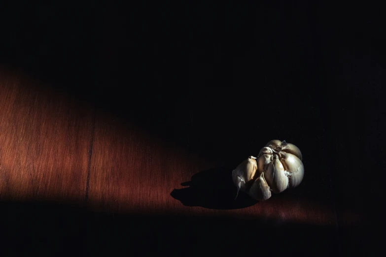 a whole garlic clove is lying on the ground