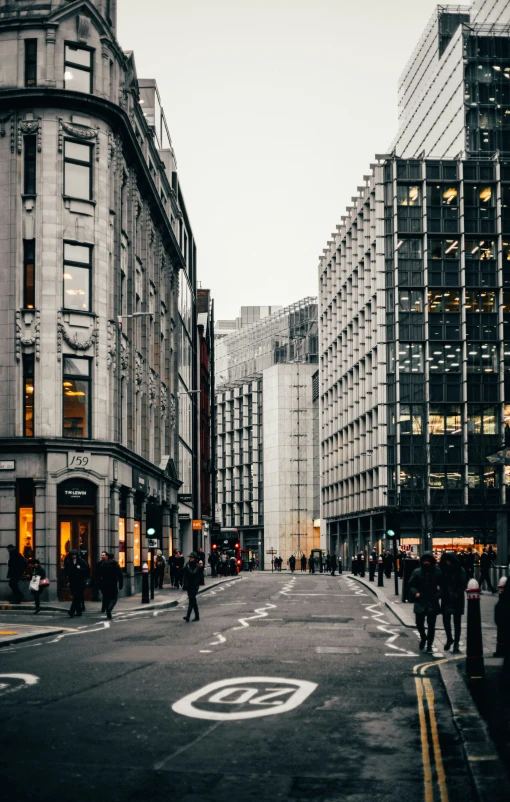 people walking down a city street during the day