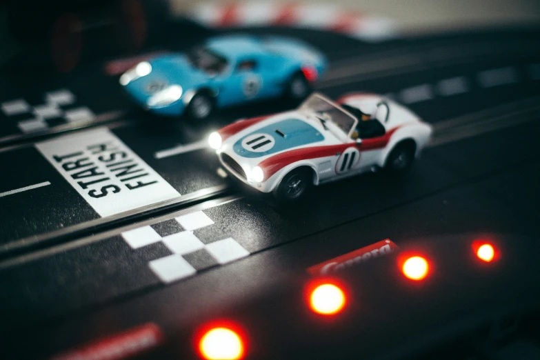 toy cars racing on the track in a race track