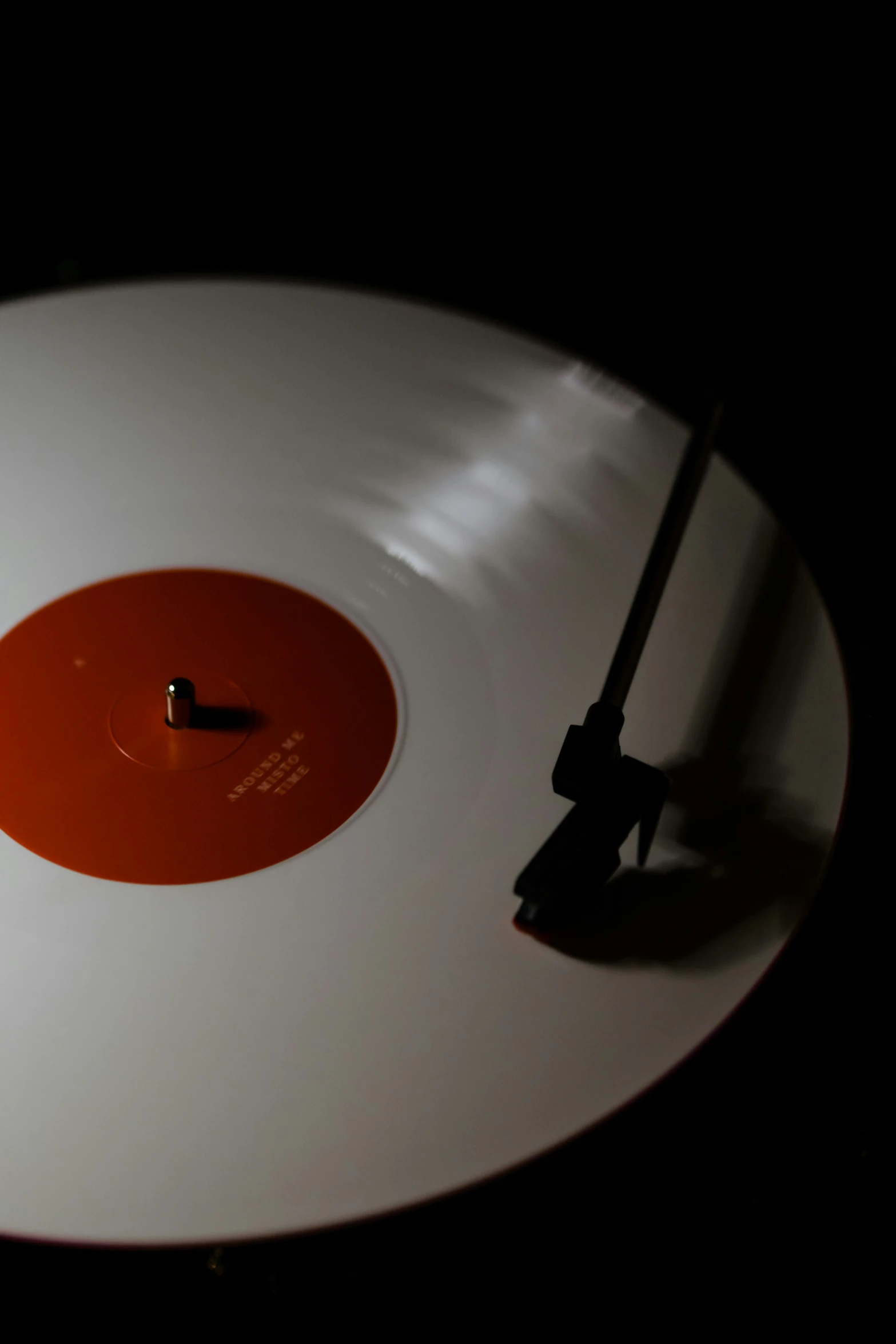 a single vinyl disc laying on the table with the cover opened