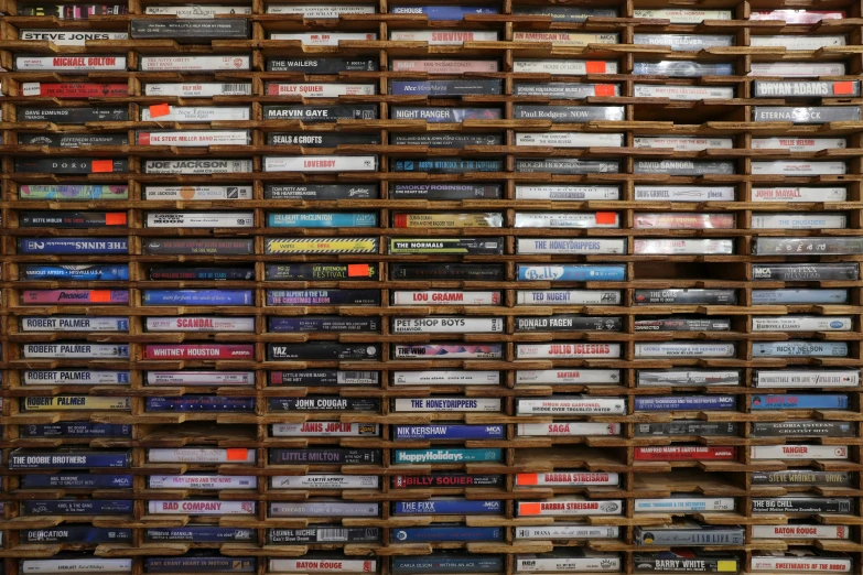 a wall of many stacks of dvd's on display