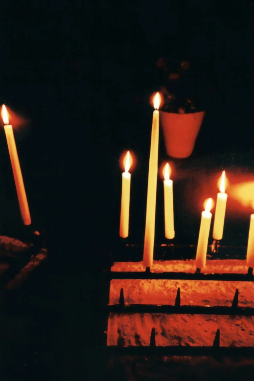 a candle is lit in an old temple