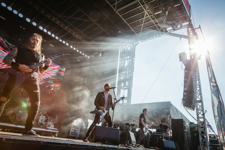 band playing on stage in large open arena