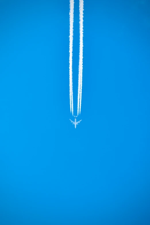 the two planes are flying in the sky together