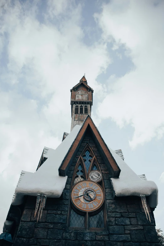 an old church steeple has a clock and weather vane