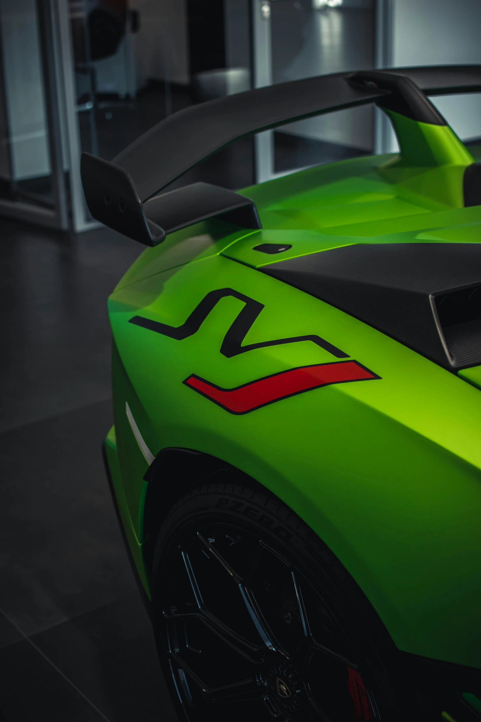 the back of a lime green sports car with its hood open