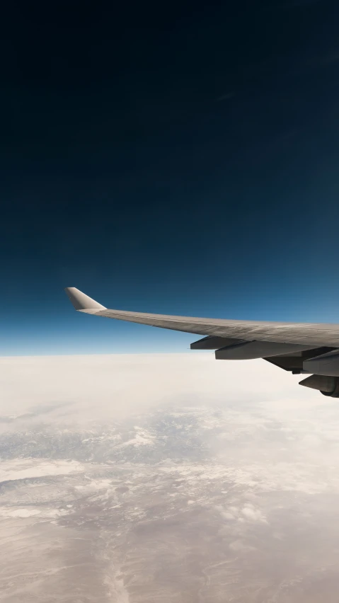 a view out the plane window, looking at the earth