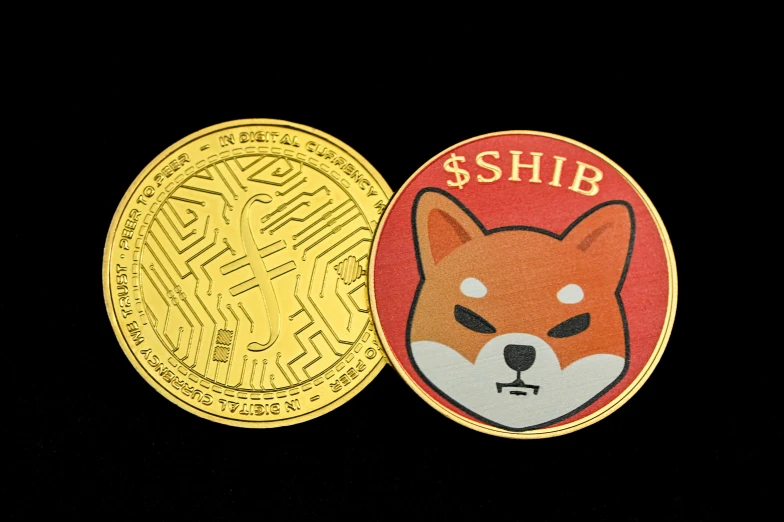 two coins on a black surface, one is for shib and the other for a little fox