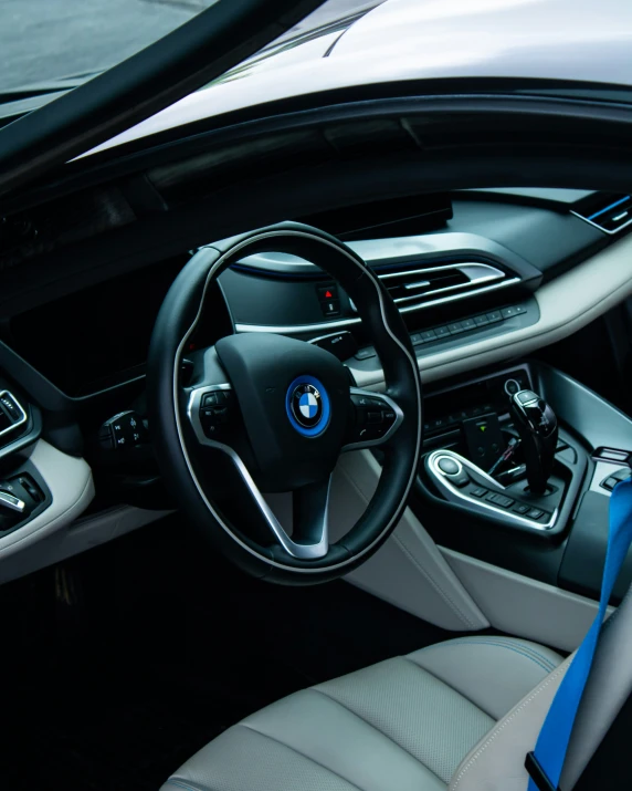 the inside view of a bmw vehicle with beige and blue interior