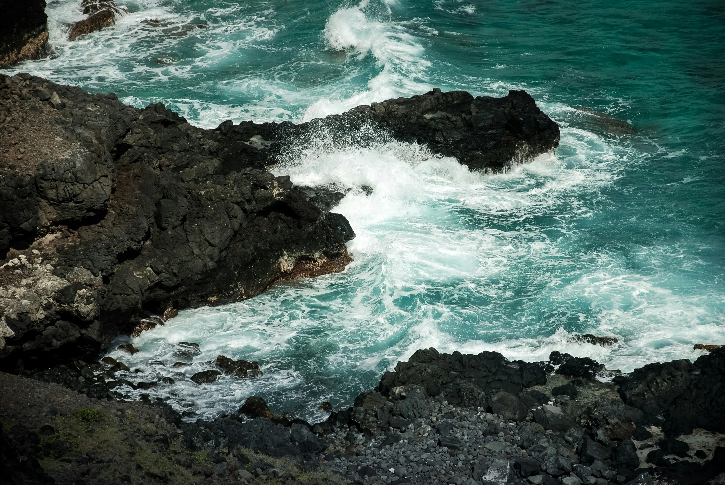 the rocks along the coast are covered in water