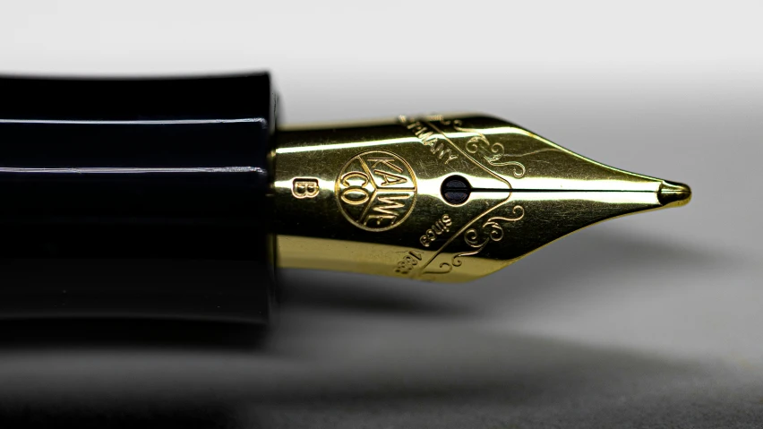 a close up view of a pen and its tip