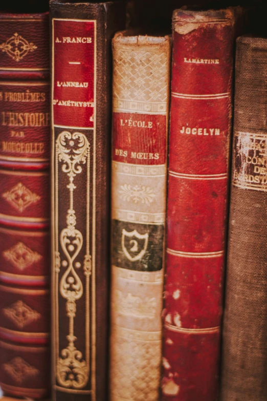 a stack of books is sitting on a book shelf