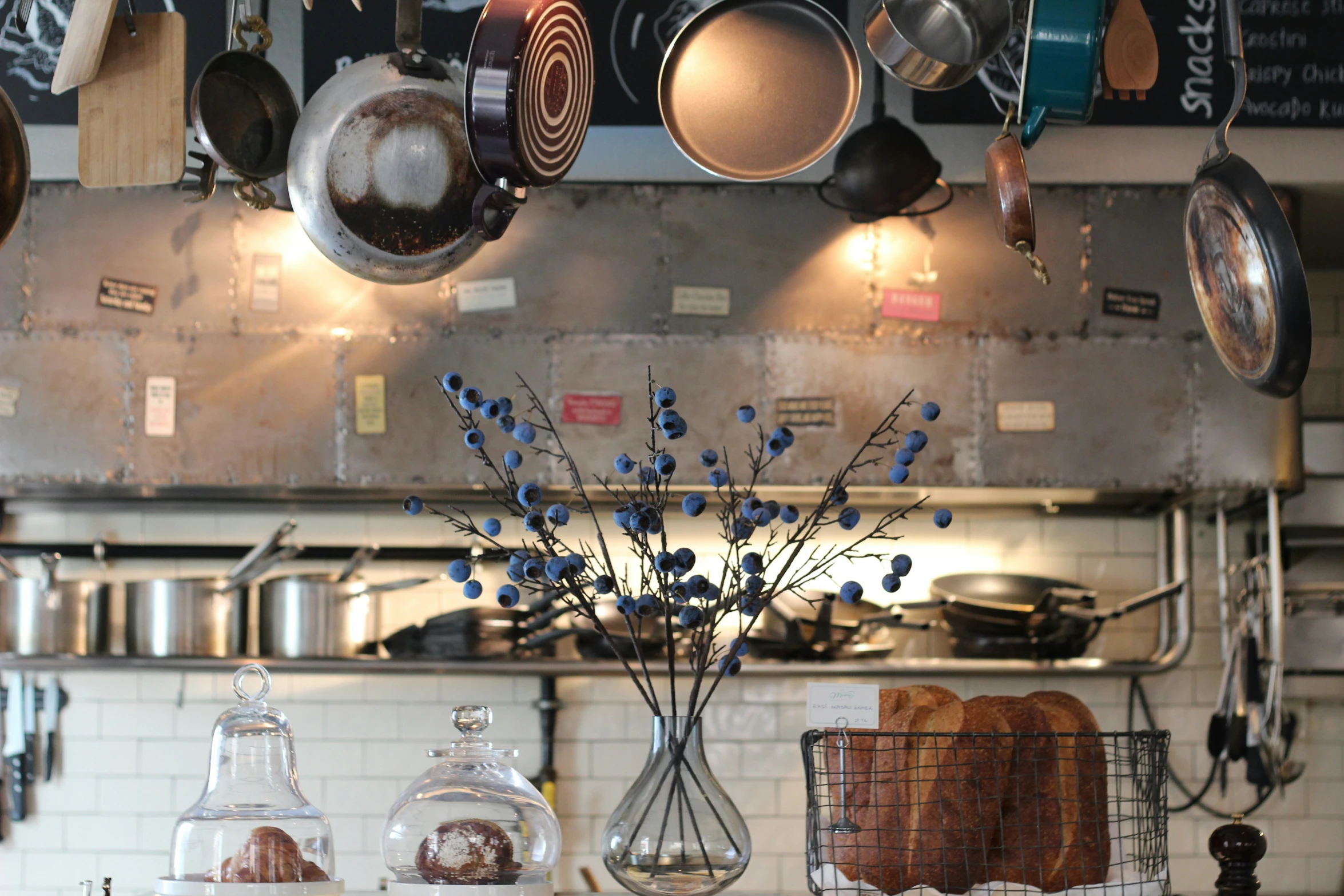 various pots and pans hanging in a kitchen