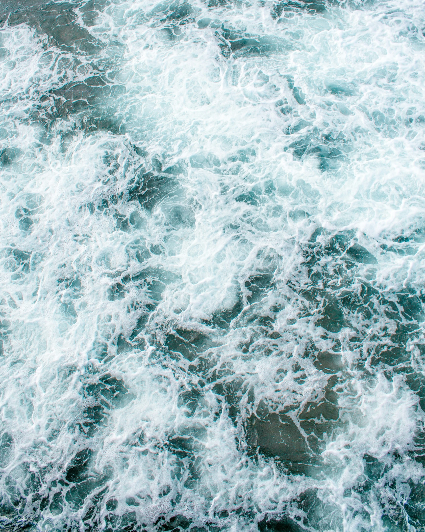 view from above looking down on a body of water with rocks