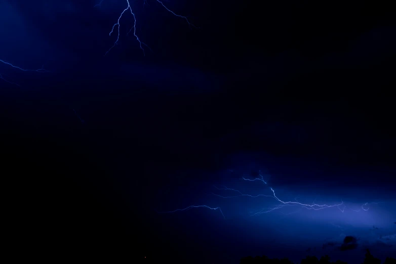 the image shows two lightning strikes hitting through the sky