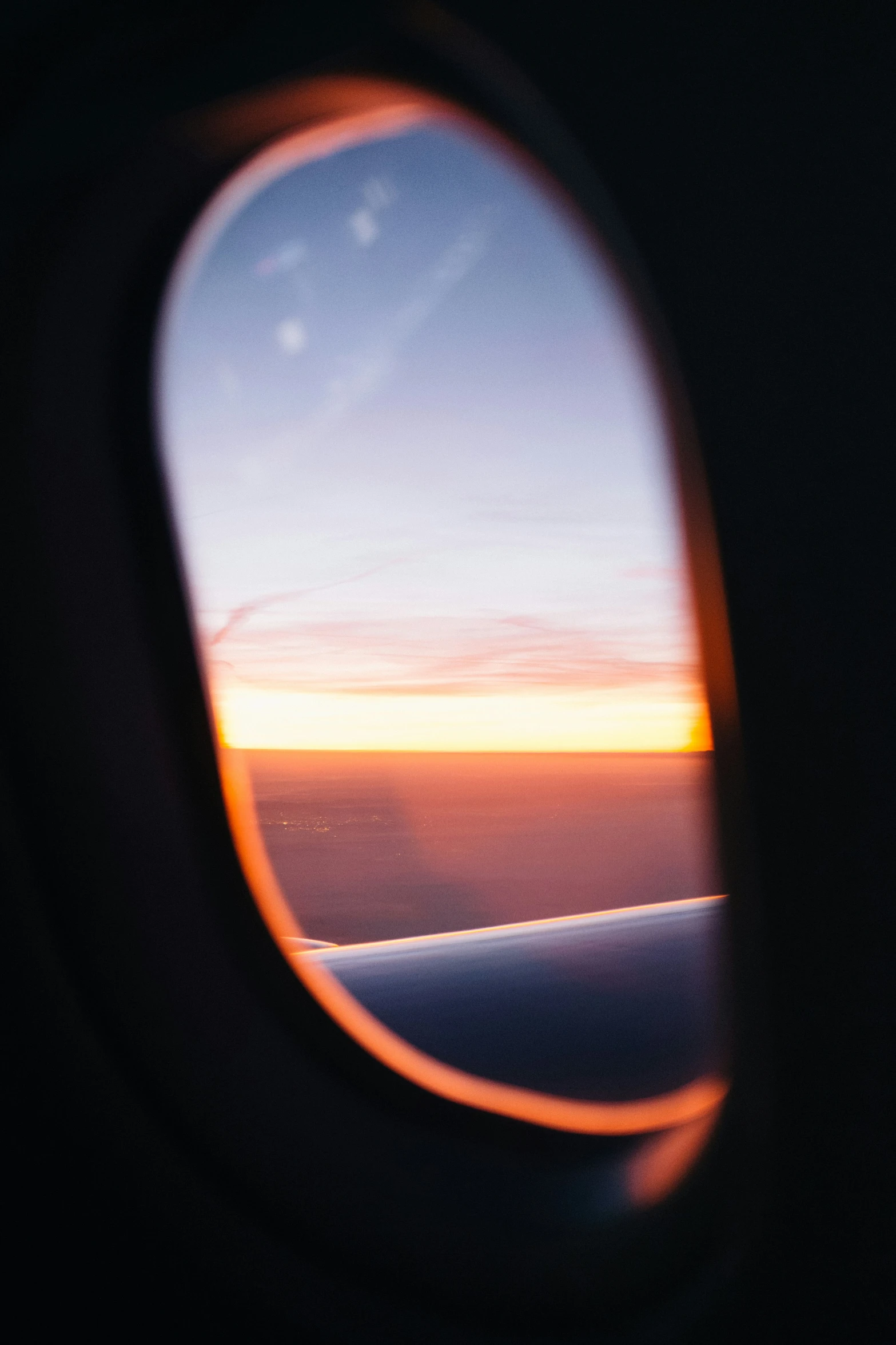 a view of the sunset out an airplane window