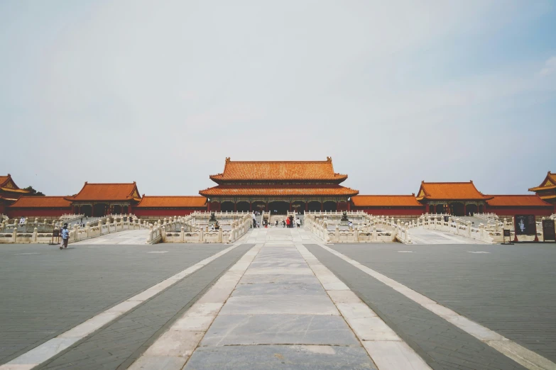 the landscape of an asian palace, a building with two towers and gates