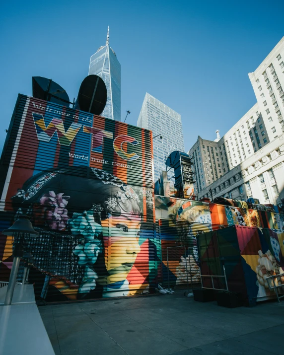 large mural in city on corner with street lights