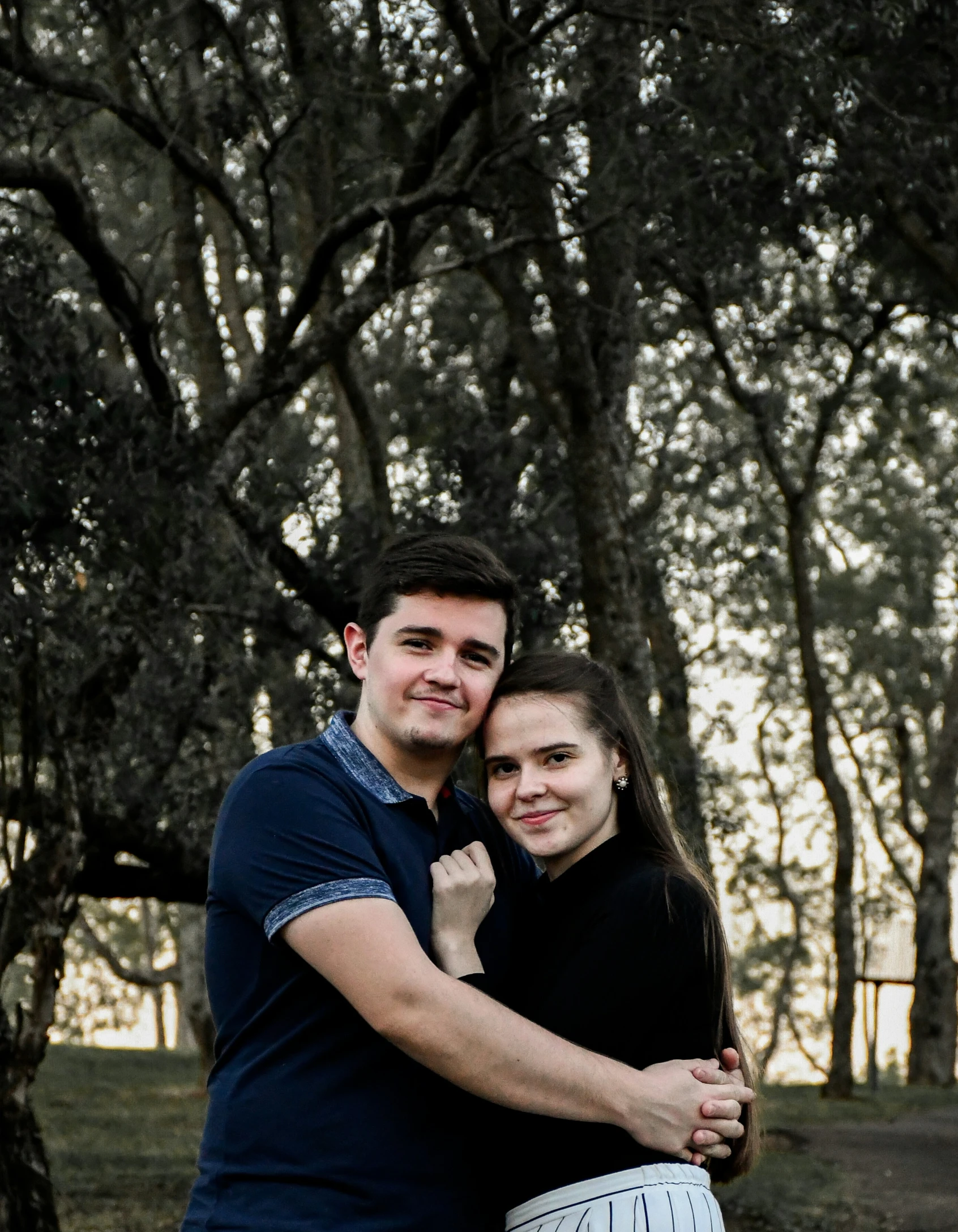 a man and woman posing for the camera together