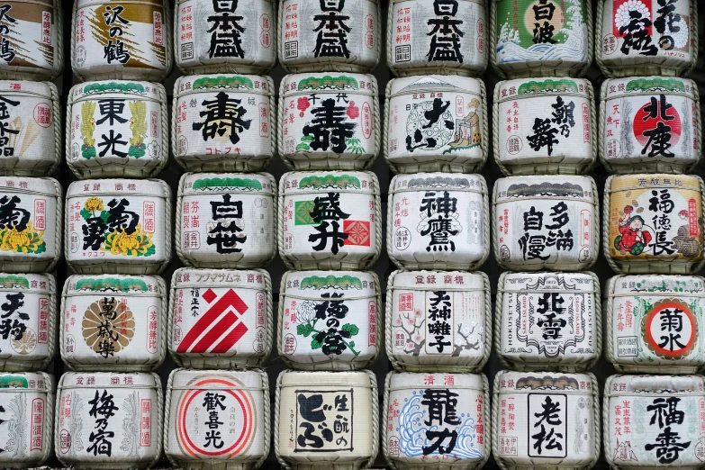 a shelf full of rolls covered in japanese symbols