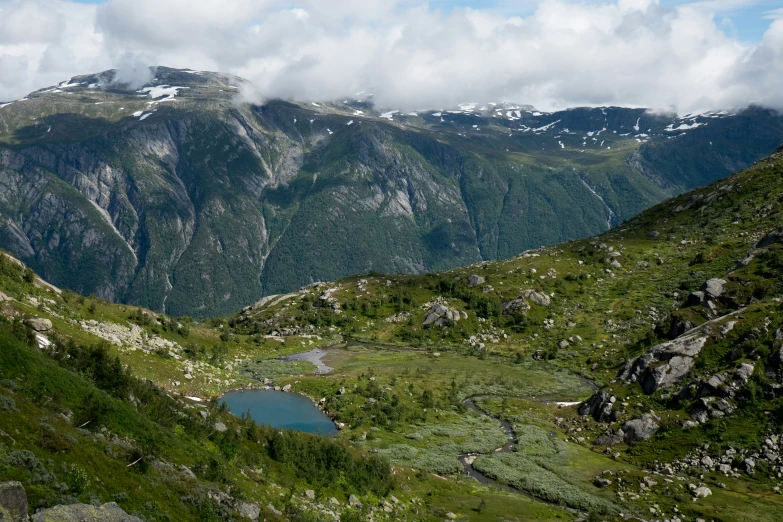 there is a large mountain range with mountains in the background